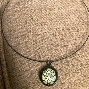 Chocker necklace black and white charm on a black chocker